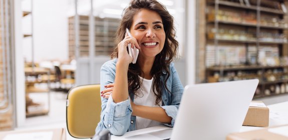 happy lady making a call one the phone