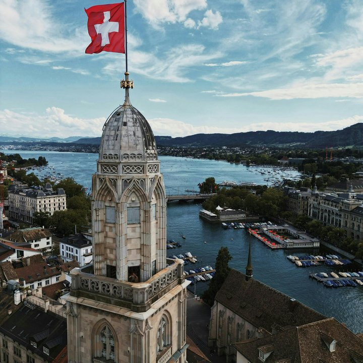 Aerial View of Zurich with Swiss Flag on Church Tower