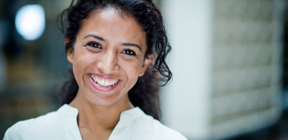 Woman in white shirt smiling