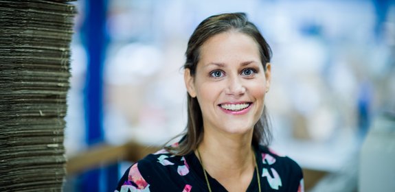 Woman with brown hair smiling