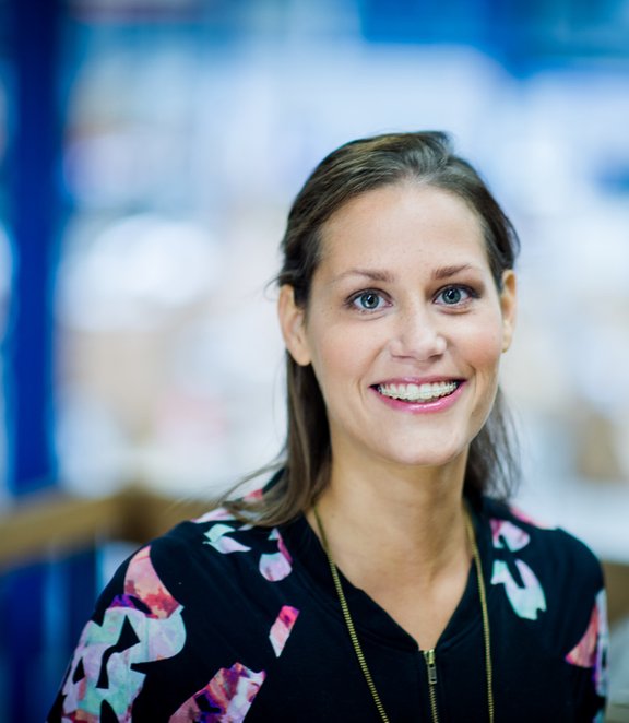 Woman with brown hair smiling